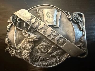 Hebilla de cinturón vintage 1985 Siskiyou Idaho con alce, montañas, sello estatal Foto 1 de 4