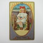 Easter Postcard Blonde Girl Red Hair Bow Rabbits Colored Eggs Embossed Antique