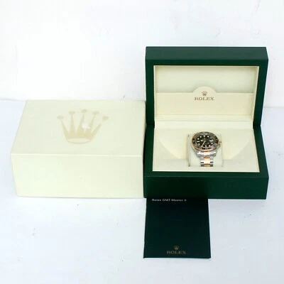 Reloj Rolex GMT-Master II 116713 2 tonos para hombre con caja de mano GMT verde y libro Foto 1 de 4