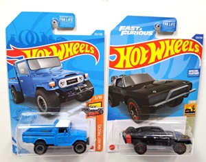 Hot Wheels 2Pcs / Toyota Land Cruiser Hot Trucks & 70 Dodge Charger Baja Blazer - Picture 1 of 3