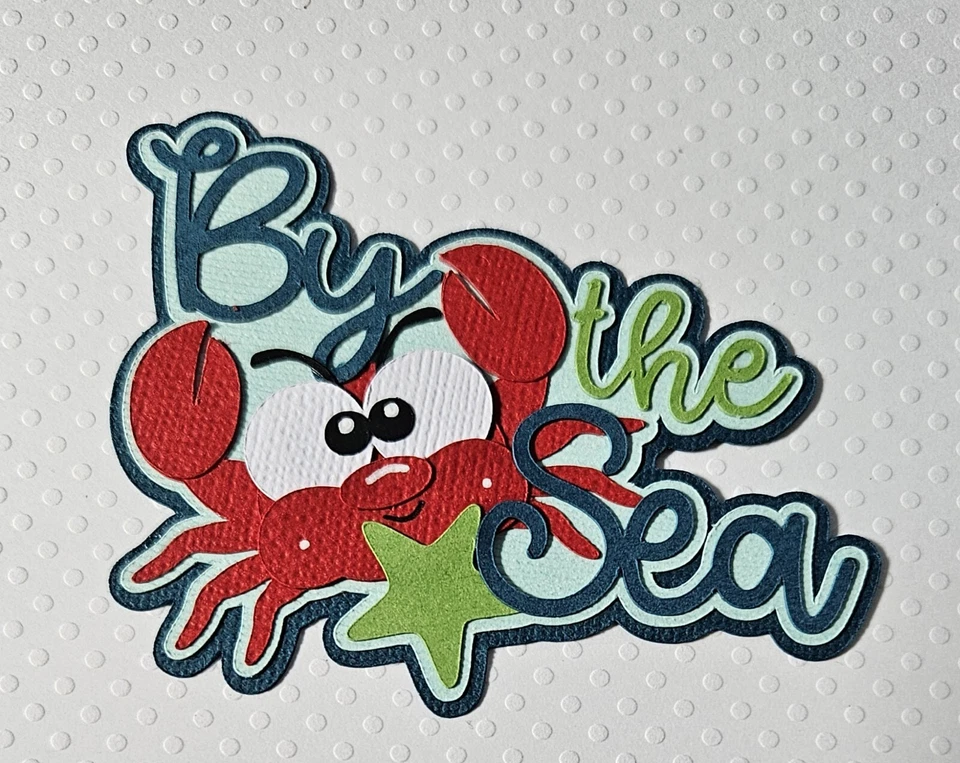 Título por mar. Álbum de recortes, piezas de papel para hacer tarjetas Foto 1 de 1