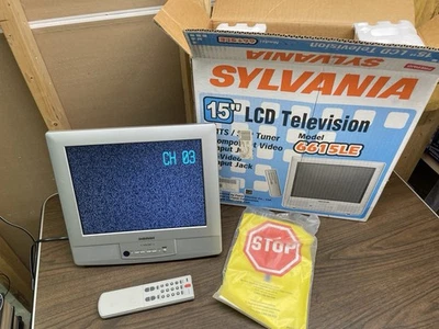 Sylvania 6615LE 15-inch Flat Panel 4:3 LCD Stereo TV with Hinge Stand + Remote - Image 1 of 4