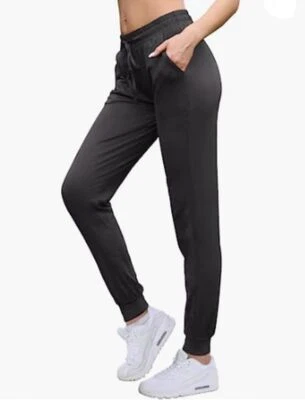 Pantalones deportivos cómodos súper elásticos para mujer con cordón/bolsillos Foto 1 de 4