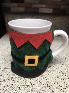 Suéter tejido verde elfo navidad marcas Momentum taza de té café 12 oz - Imagen 1 de 6