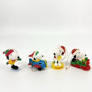 Vintage Snoopy Christmas Ornaments PVC Airplane Train Santa Peanuts Set of 4 - Picture 1 of 7