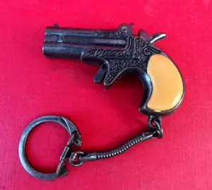 DERRINGER CAP PISTOL TOY KEYRING METAL MADE HONG KONG VINTAGE PISTOLA - Foto 1 di 10