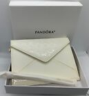 Pandora ivory clutch/wristlet.  New in box, original packaging, never used