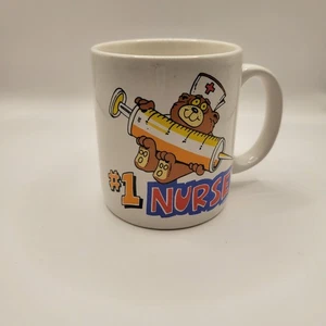 Vintage #1 Krankenschwester Kaffee Tee Becher Bär Spritze Regenbogen 1 Contenova 80er 90er EUC - Bild 1 von 4