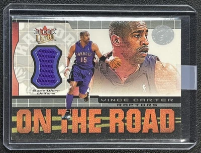 VINCE CARTER 2001-02 FLEER ULTRA #NNO ON THE ROAD PLATINUM MEDALLION JERSEY /25 - Image 1 of 2
