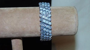 PULSERA ELÁSTICA DE COLECCIÓN TONO PLATEADO CON PIEDRAS TRANSPARENTES 4 CAPAS - Imagen 1 de 6