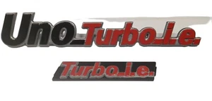 Escrituras "UNO TURBO I.E." Trasera + "TURBO I.E." Delantera En Plástico - Imagen 1 de 5