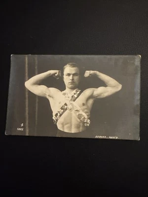 C 1915 Strongman Impressive Chest Muscle Biceps Pose Sash Medal Bodybuilder RPPC - Image 1 of 4