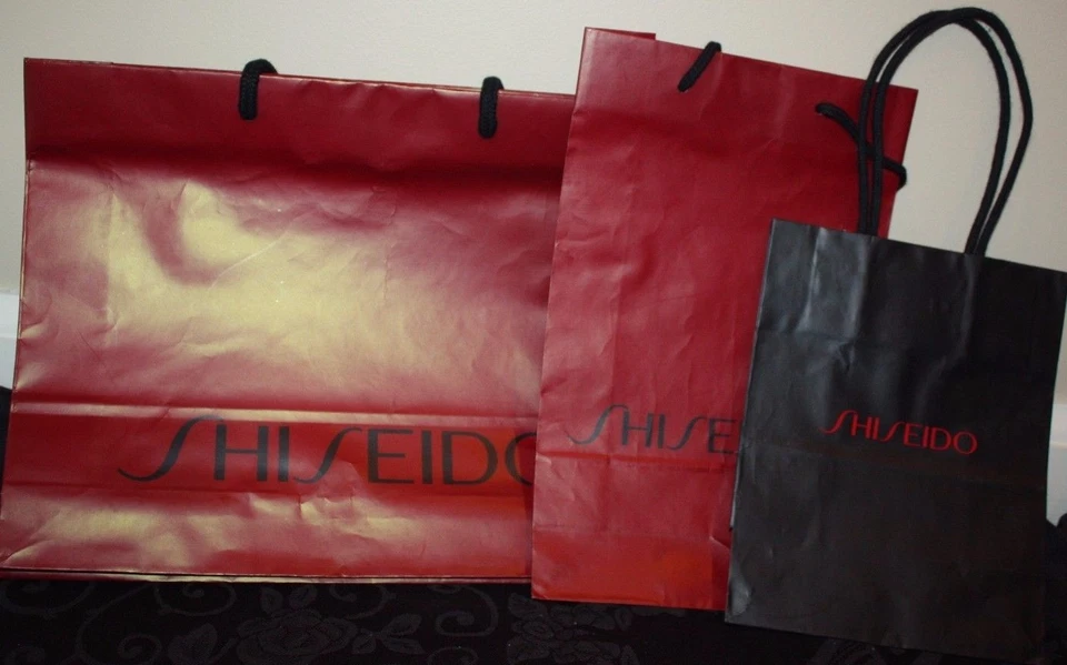 3 bolsos de mano vacíos de papel negro granate con logotipo de diseñador Shiseido Store para regalo Foto 1 de 1