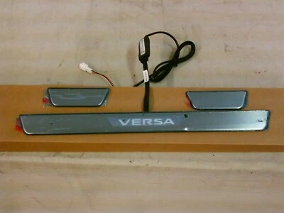 2012-2014,2015,2016,2017,2018,2019 Nissan Versa Sedan Illuminated Kick Plate OEM - Image 1 of 4
