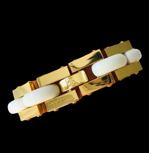 Bracciale grosso oro TORY BURCH nuovo con intarsio bianco. Coni con etichetta e sacchetto antipolvere