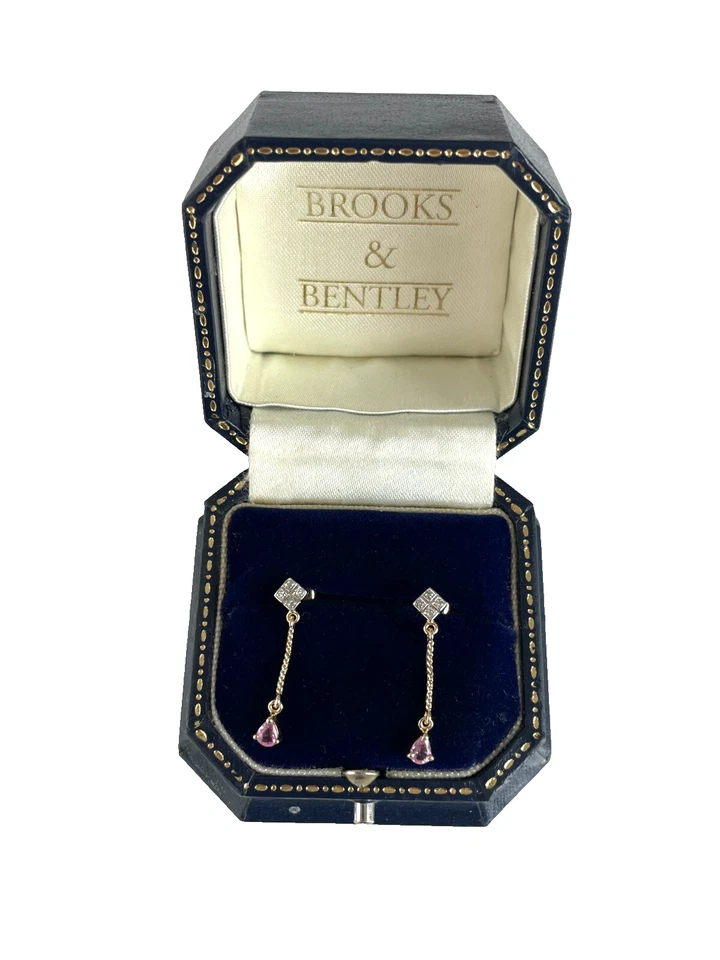Pendientes colgantes de zafiro de oro de 9 quilates con diamantes y zafiro rosa púrpura Foto 1 de 4