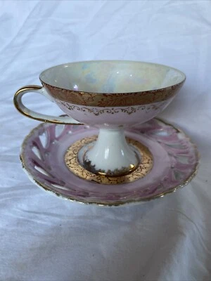 Antigua taza de té con pedestal de porcelana de hueso oro rosa blanco platillo de lujo iridiscente Foto 1 de 4