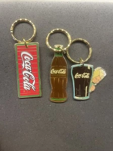 Lotto Portachiavi In Metallo Coca Cola - Foto 1 di 3