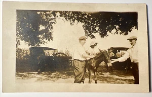 Postal con foto real antigua niño afroamericano de 1900 en burro paseo RPPC - Imagen 1 de 10