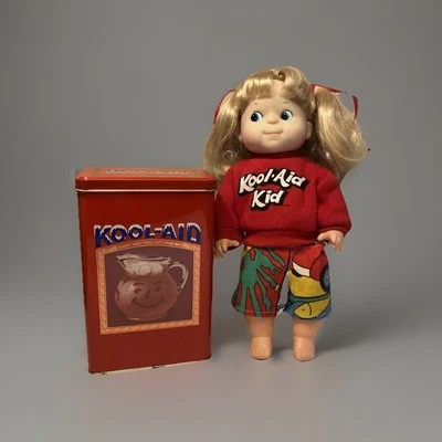 Muñeca niña Kool-Aid Kid vintage rubia ojo azul años 80 y lata coleccionable. Foto 1 de 4