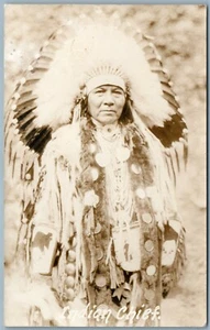 AMERICAN INDIAN CHIEF in HOLIDAY DRESS ANTIQUE REAL PHOTO POSTCARD RPPC - Picture 1 of 2