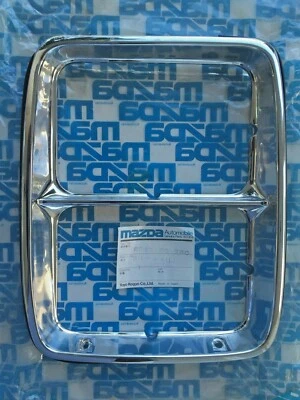 Mazda 929 1979 - 1980 Left Headlight Trim Part # 8545 50 760 NOS - Image 1 of 3