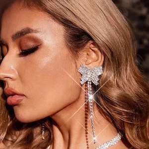 Pierced 4 3/4" long silver and dangle clear stone butterlfy earrings - Bild 1 von 4