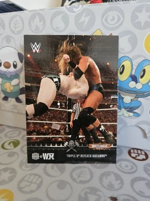 2015 Topps WWE Road to Wrestlemania XXVI #7 - Triple H Defeats Sheamus - Image 1 of 2