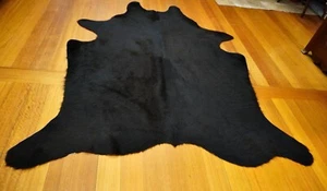 A Neat and Compact Jet Black Aberdeen Angus Cowhide Rug -  Naturally Beautiful - Picture 1 of 10