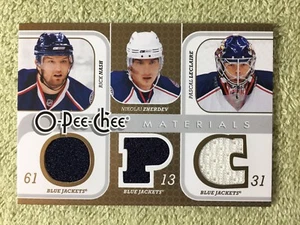 2008-09 O-Pee-Chee RICK NASH & ZHERDEV & LECLAIRE blaue Jacken aus drei Materialien  - Bild 1 von 2