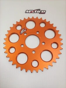 Piñón trasero ultraligero de aluminio Renthal 50SX 38T naranja 480--415-38O 2917 - Imagen 1 de 4