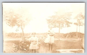 Postcard Unidentified RPPC, Two Girls, Children Posing, Girl Holding Kitten Cat  - Picture 1 of 2
