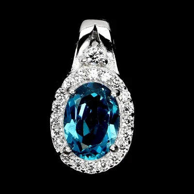 Colgante de plata de ley 925 ovalado topacio azul Londres 7x5 mm joyas de piedras preciosas Foto 1 de 4