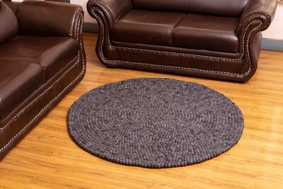 Add a Touch of Elegance to Your Space with Handmade Black Circular Wool Carpet- - Image 1 of 4