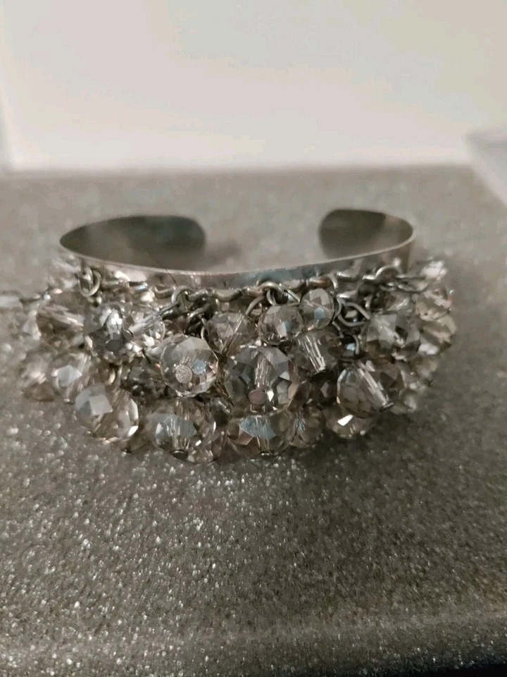  Brazalete de acero inoxidable con piedras de cristal ahumado. Usado en excelente estado Foto 1 de 4