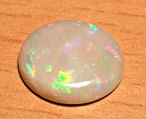 White Opal Solid Australian Good Displays of All Colours 12 x 10 x 3 mm. 2.45ct - Picture 1 of 5