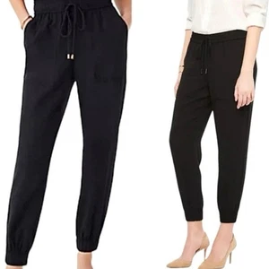 Pantalones de chándal Ann Taylor Petite extra pequeños de crepé tiro medio bolsillos negros lisos - Imagen 1 de 8