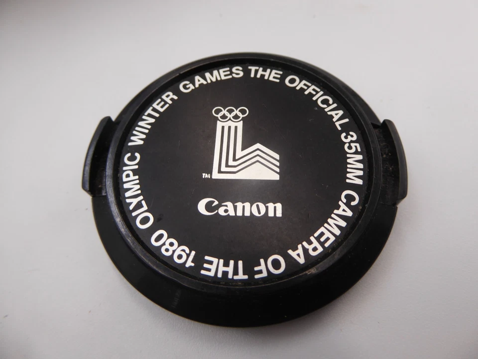 Canon genuine 35mm Camera of the 1980 Winter Olympic Games' C-52mm Lens Cap - Image 1 of 2