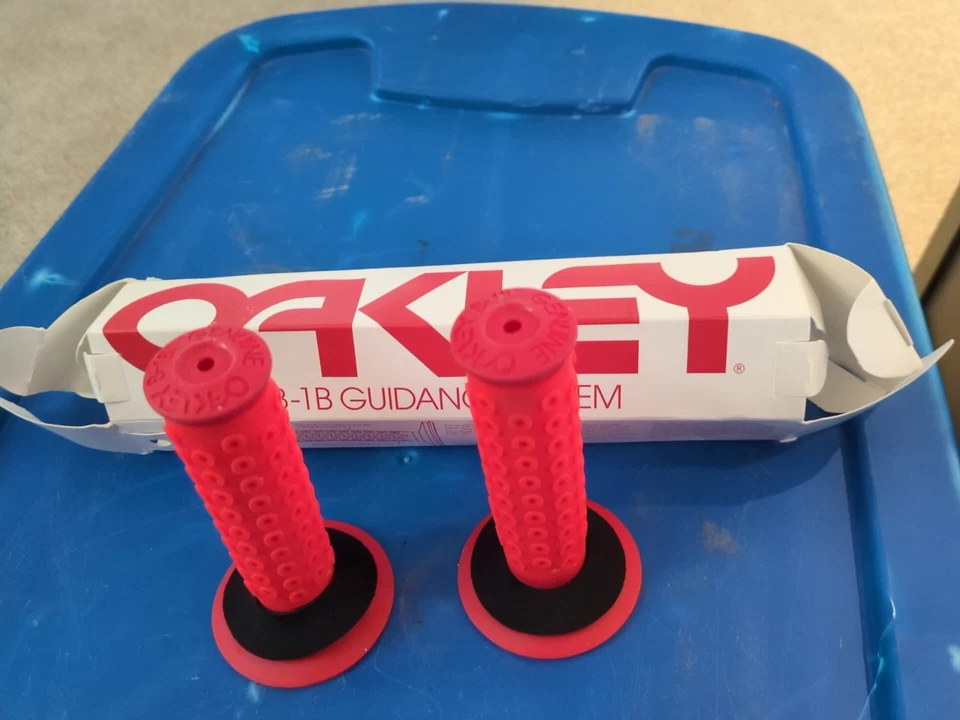 NOS 2010 reissue Oakley B-1B Grips Original packaging(red)  - Image 1 of 4