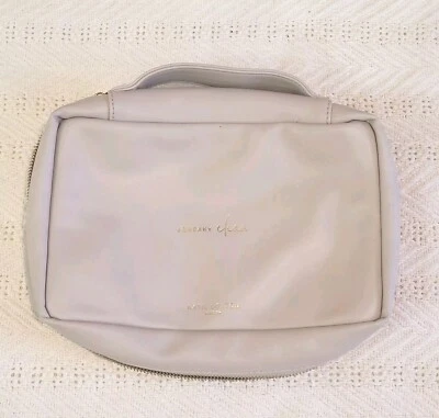 Bolsa organizadora de pañales Katie Loxton Squeky Clean cambio rápido para bebé beige 7"x11' Foto 1 de 4