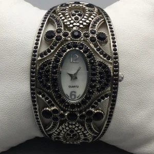 Black Crystals Watch Women 35mm Silver Tone Oval Dial Hinged Cuff New Battery - Picture 1 of 14
