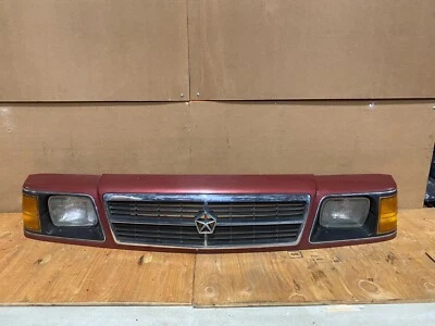 Bisel de faro derecho Plymouth Reliant 1985 1989 con marcador de giro OEM E5535 Foto 1 de 4