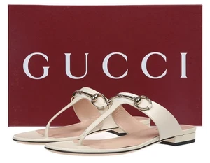 NUEVOS ZAPATOS SANDALIAS PLANAS TANGA ENTRELAZADA MARFIL CUERO LUJO GUCCI 37.5/7.5 - Imagen 1 de 6