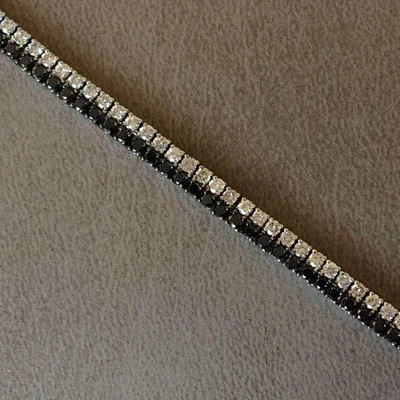 Pulsera tenis doble fila | oro blanco 18k con diamantes blancos y negros Foto 1 de 4
