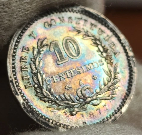 1877 Uruguay 10 Centesimos Silver (.900) First Year Issue Rainbow Toned Cover