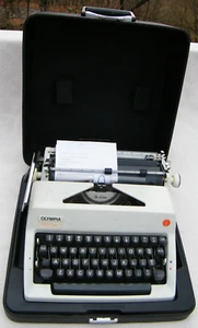 Vintage Olympia De Luxe Manual Typewriter in Black Case Working - Picture 1 of 17