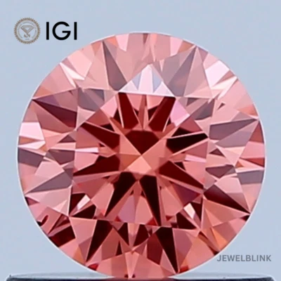 IGI Certified 0.60 Carat Fancy Vivid Pink VS2 Round Cut CVD Lab Grown Diamond - Image 1 of 4