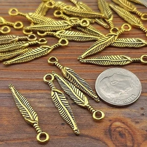 10 pezzi ciondoli in metallo tono oro piuma, forniture per fare gioielli - Foto 1 di 1