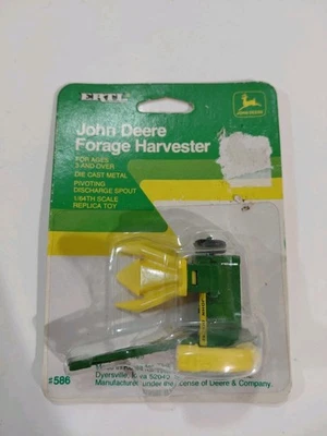 Nuevo en Paquete Ertl 586 Die Cast 1/64 John Deere Cosechadora de Forja Implemento de Granja Foto 1 de 4