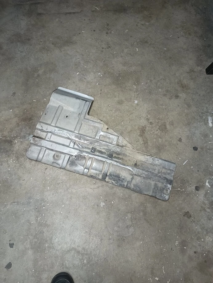 85 86 87 88 Pontiac Fiero OEM cortafuegos delantero escape lateral protector térmico 014 Foto 1 de 1